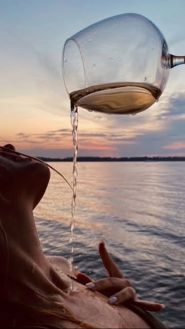 Palm Beauty on Instagram: May be an image of drink, wine glass, body of water and text